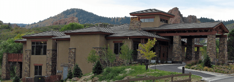 Roxborough Park Foundation Community Center with red rock formations behind it